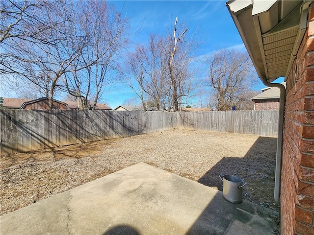 view of yard with a fenced backyard and a patio