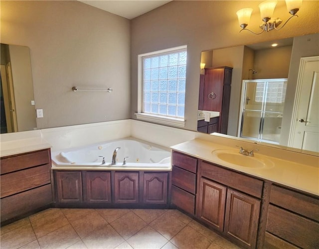 full bath with a chandelier, vanity, a jetted tub, tile patterned floors, and a stall shower