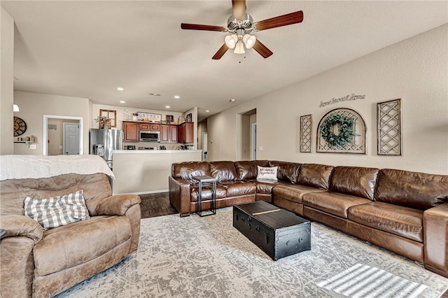 living area featuring ceiling fan, wood finished floors, and recessed lighting