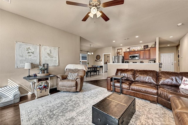 living room with dark wood-type flooring, recessed lighting, visible vents, and a ceiling fan