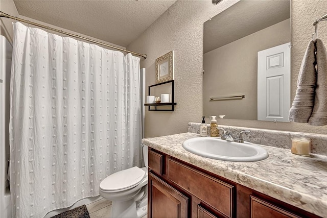 full bath with a textured wall, a textured ceiling, toilet, and vanity