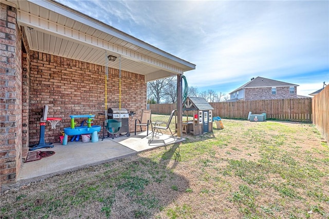 view of yard featuring a patio area and a fenced backyard