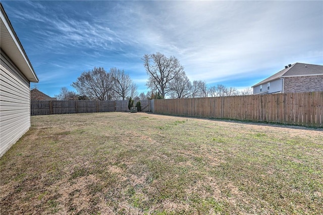 view of yard featuring a fenced backyard