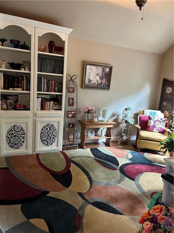 sitting room with vaulted ceiling