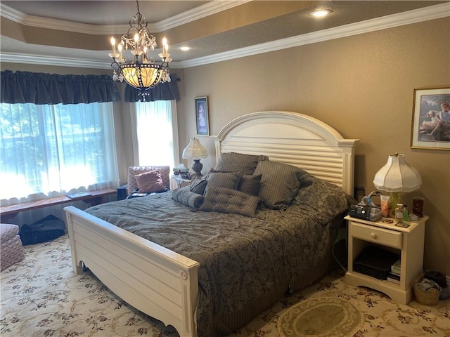 bedroom with an inviting chandelier, ornamental molding, and a raised ceiling