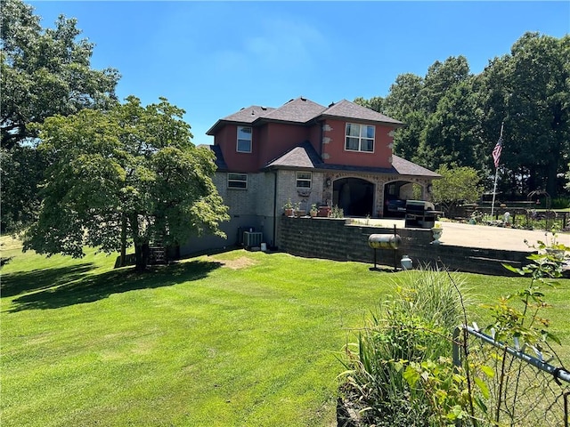 view of front of house with a front yard and fence