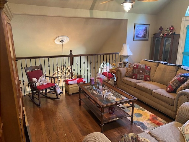 living area with a ceiling fan, lofted ceiling, and wood finished floors