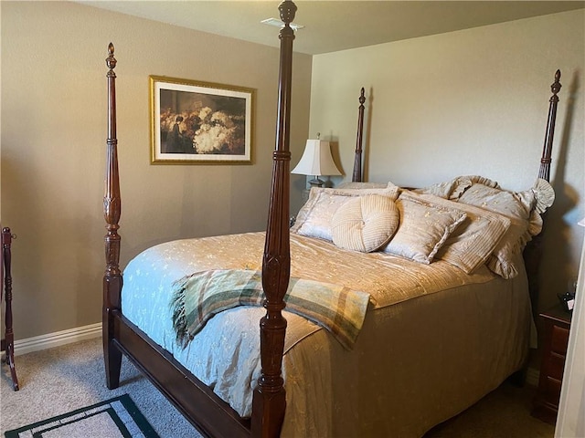 carpeted bedroom featuring baseboards