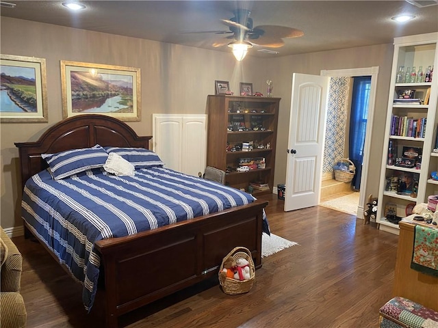 bedroom featuring dark wood finished floors and recessed lighting