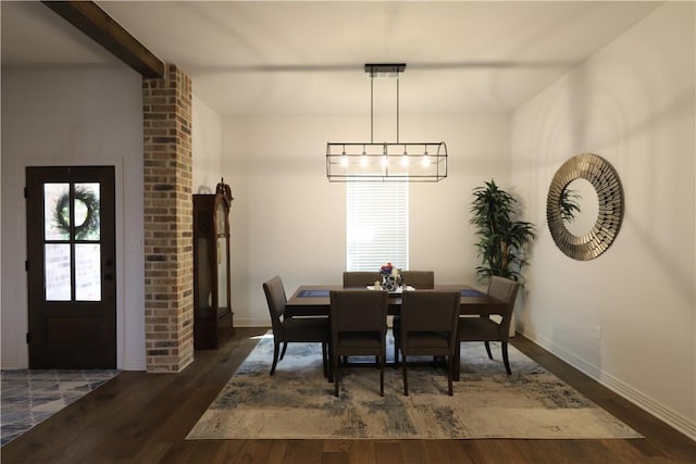 dining area featuring baseboards and wood finished floors