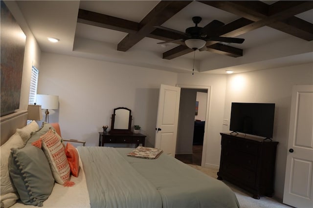 bedroom with beamed ceiling, coffered ceiling, and ceiling fan