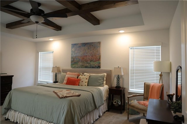 bedroom featuring beamed ceiling, light carpet, and a ceiling fan