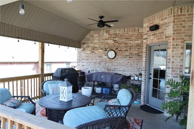 wooden terrace featuring outdoor lounge area, a grill, and a ceiling fan