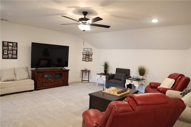 living room featuring visible vents, baseboards, ceiling fan, vaulted ceiling, and light carpet