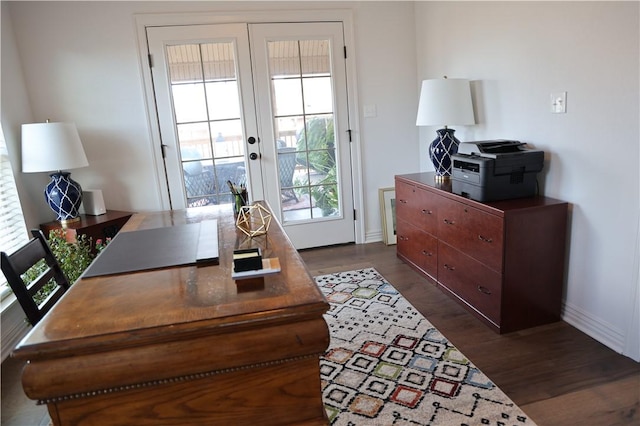 office area with dark wood finished floors, french doors, and baseboards