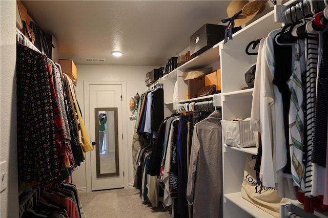 spacious closet with visible vents and light carpet