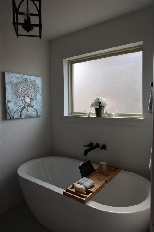 full bath featuring a soaking tub