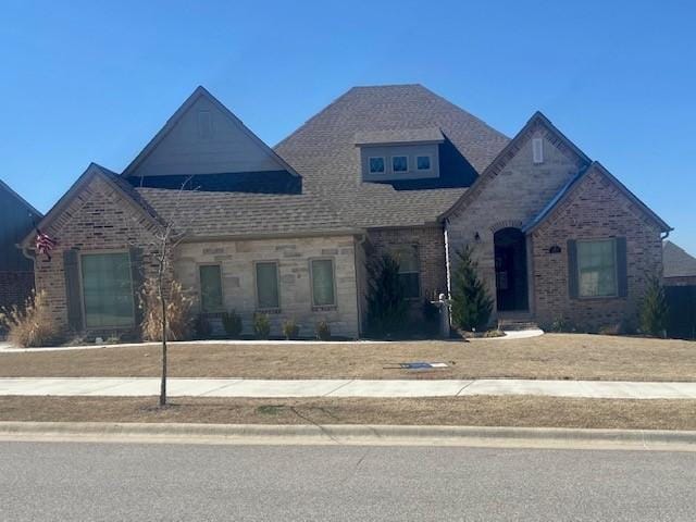 view of front of house with brick siding