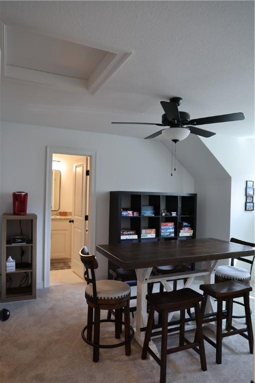 dining room with ceiling fan and carpet floors