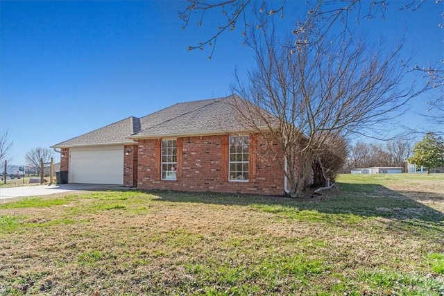 view of property exterior featuring brick siding, a lawn, concrete driveway, and a garage