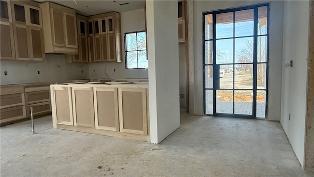 kitchen featuring unfinished concrete floors