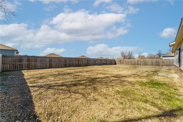 view of yard with a fenced backyard