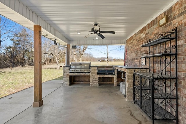 view of patio / terrace featuring area for grilling, a grill, and a ceiling fan