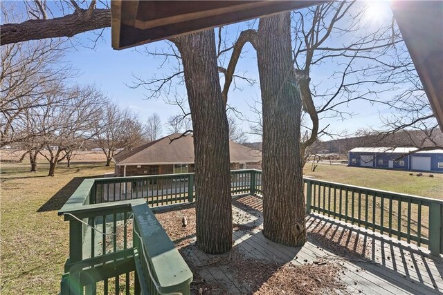 wooden terrace with a yard