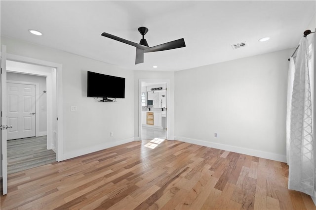 interior space featuring visible vents, baseboards, ceiling fan, light wood-type flooring, and recessed lighting