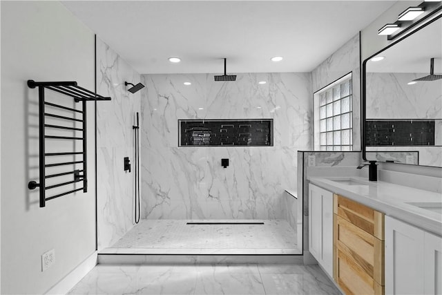 bathroom featuring recessed lighting, marble finish floor, a marble finish shower, and a sink