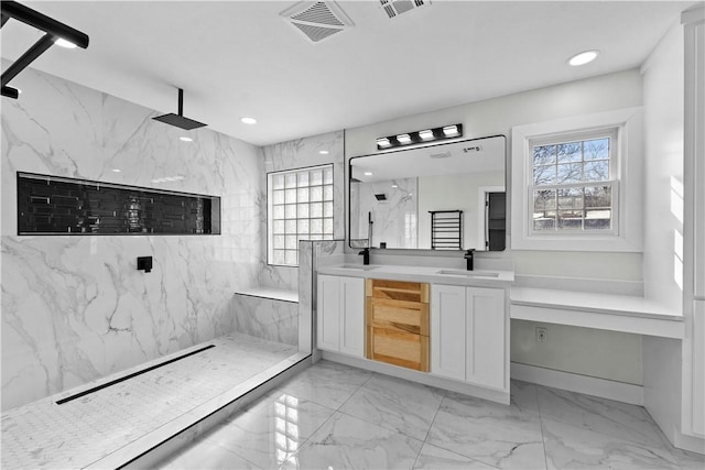 bathroom with marble finish floor, a healthy amount of sunlight, visible vents, and a marble finish shower