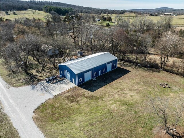 birds eye view of property featuring a rural view