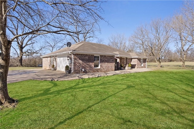 view of side of home with brick siding and a yard