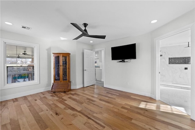 unfurnished living room with visible vents, recessed lighting, light wood-style floors, baseboards, and ceiling fan