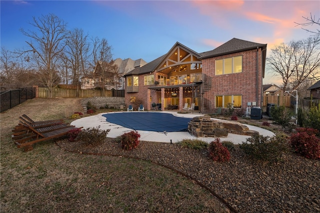 view of pool featuring a fenced in pool, a patio, central AC, and a fenced backyard