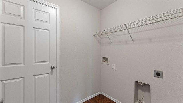 laundry room featuring electric dryer hookup, laundry area, baseboards, hookup for a washing machine, and dark wood-style flooring