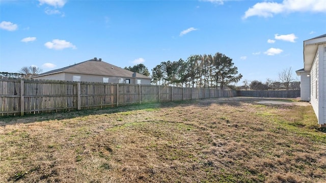 view of yard with a fenced backyard