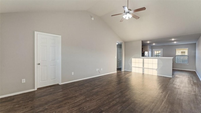 unfurnished living room with high vaulted ceiling, a ceiling fan, dark wood-style flooring, and baseboards