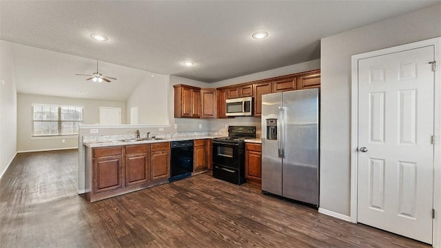 kitchen with dark wood-type flooring, light countertops, brown cabinetry, black appliances, and a sink