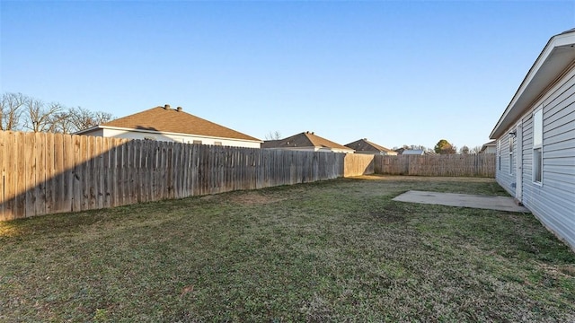 view of yard with a fenced backyard