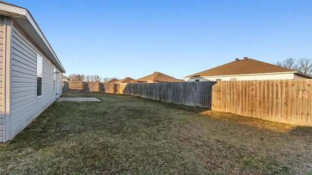 view of yard featuring a fenced backyard