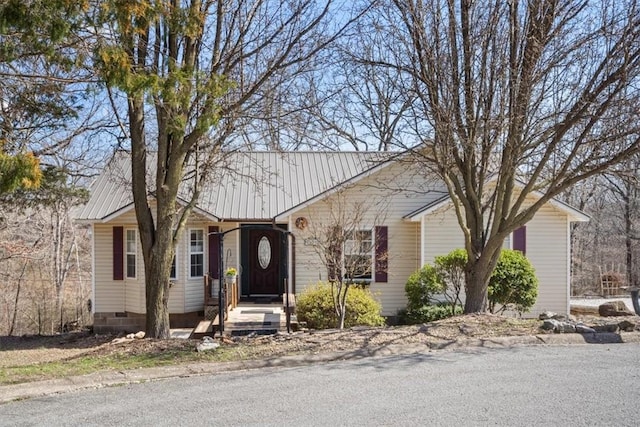 ranch-style home with metal roof