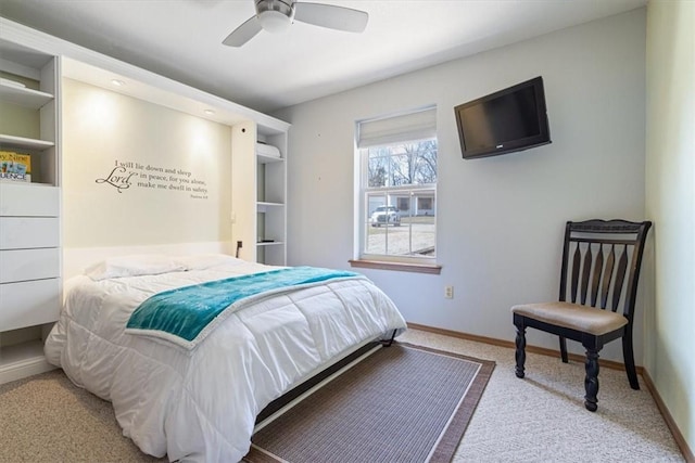 carpeted bedroom with baseboards and ceiling fan