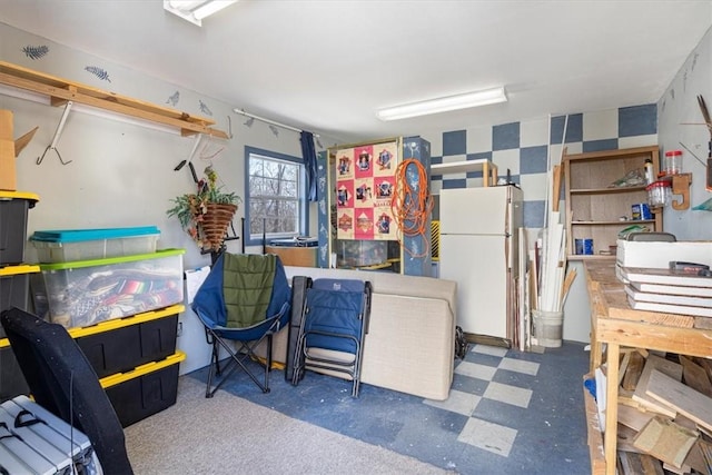 kitchen with tile patterned floors and freestanding refrigerator