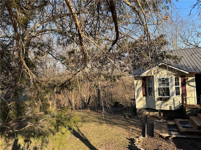 view of home's exterior featuring metal roof