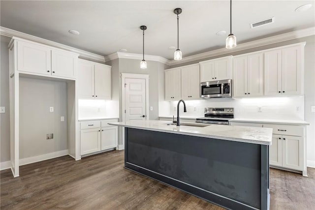 kitchen featuring visible vents, a sink, white cabinetry, stainless steel appliances, and crown molding