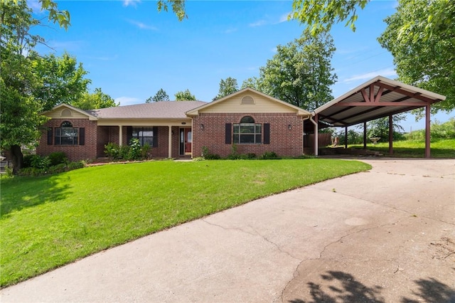 5530 Blake Ln, Springdale, AR 72762 - view of front facade featuring brick siding, a front lawn, driveway, and an attached carport
