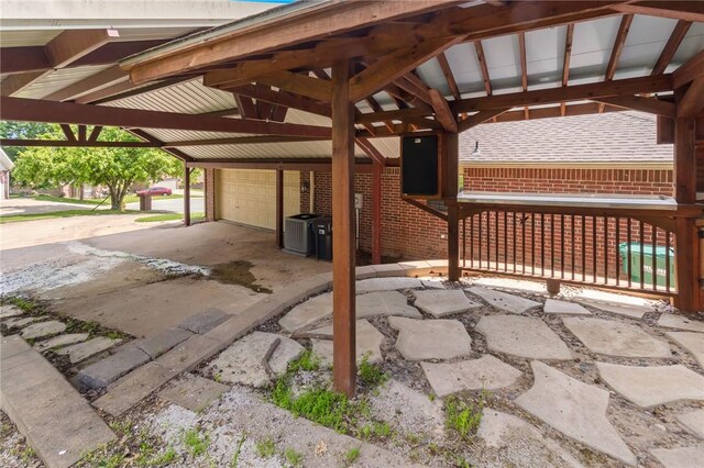 5530 Blake Ln, Springdale, AR 72762 - view of patio / terrace featuring a garage and cooling unit