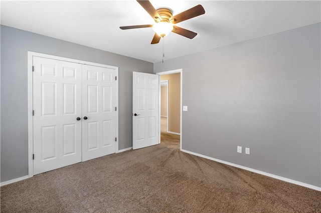 5530 Blake Ln, Springdale, AR 72762 - unfurnished bedroom with carpet flooring, baseboards, a closet, and a ceiling fan