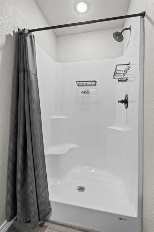 bathroom featuring a shower stall